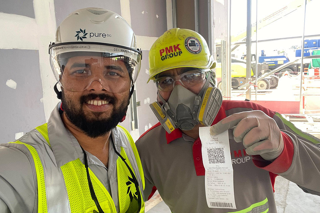 Pure DC (Pure Data Centres Group) Abu Dhabi Yas Island two workers